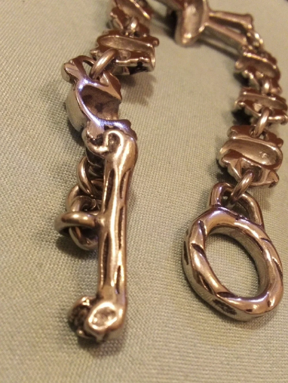 Skull & Crossbones Chunky Bracelet in Metallic Gold Tone